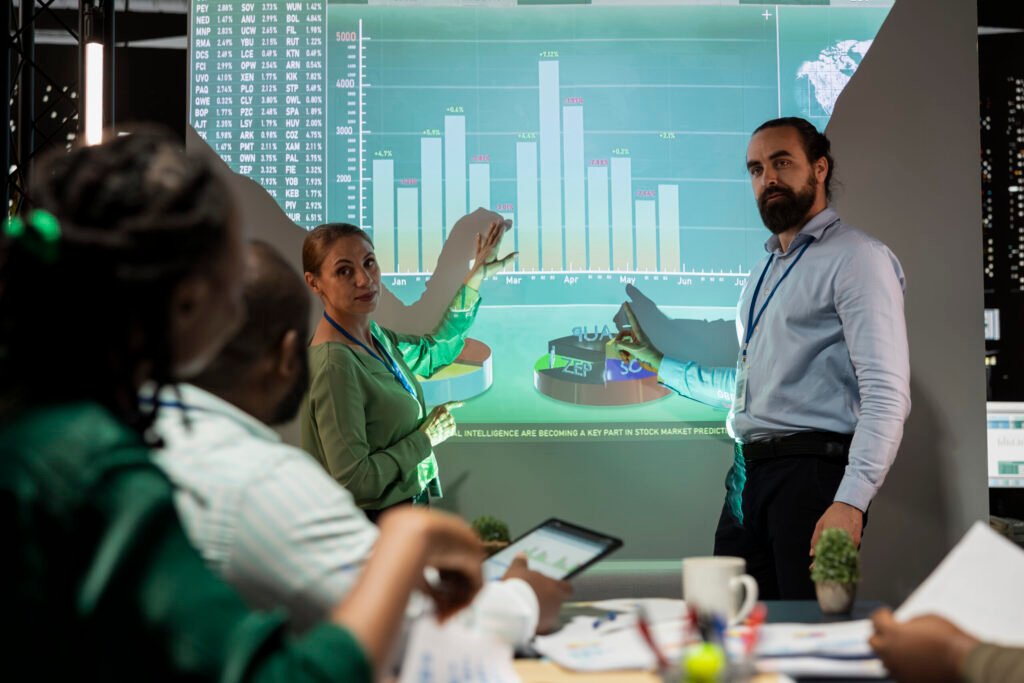 Management team sharing insight on statistics in night corporation meeting